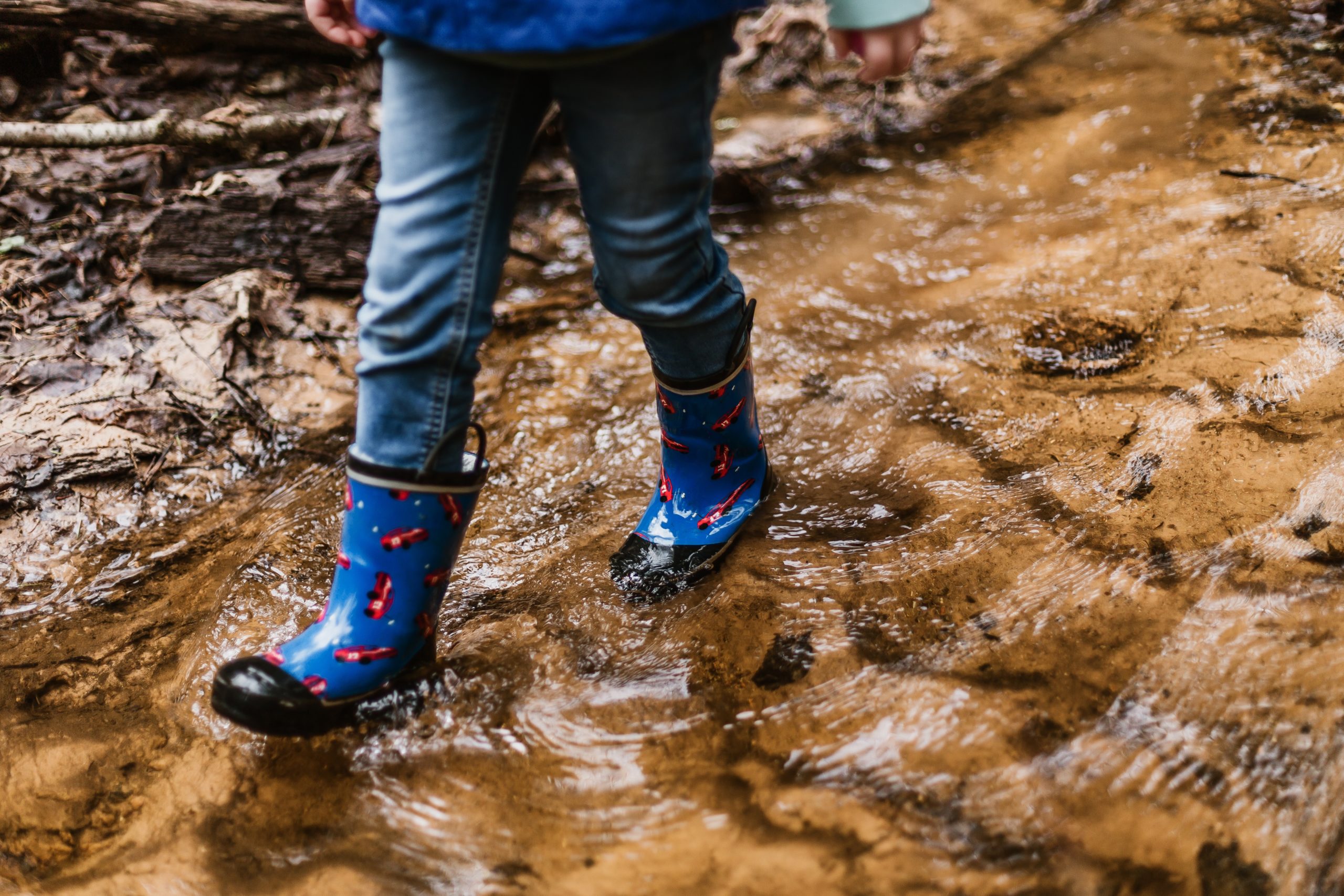 child walking in a creek